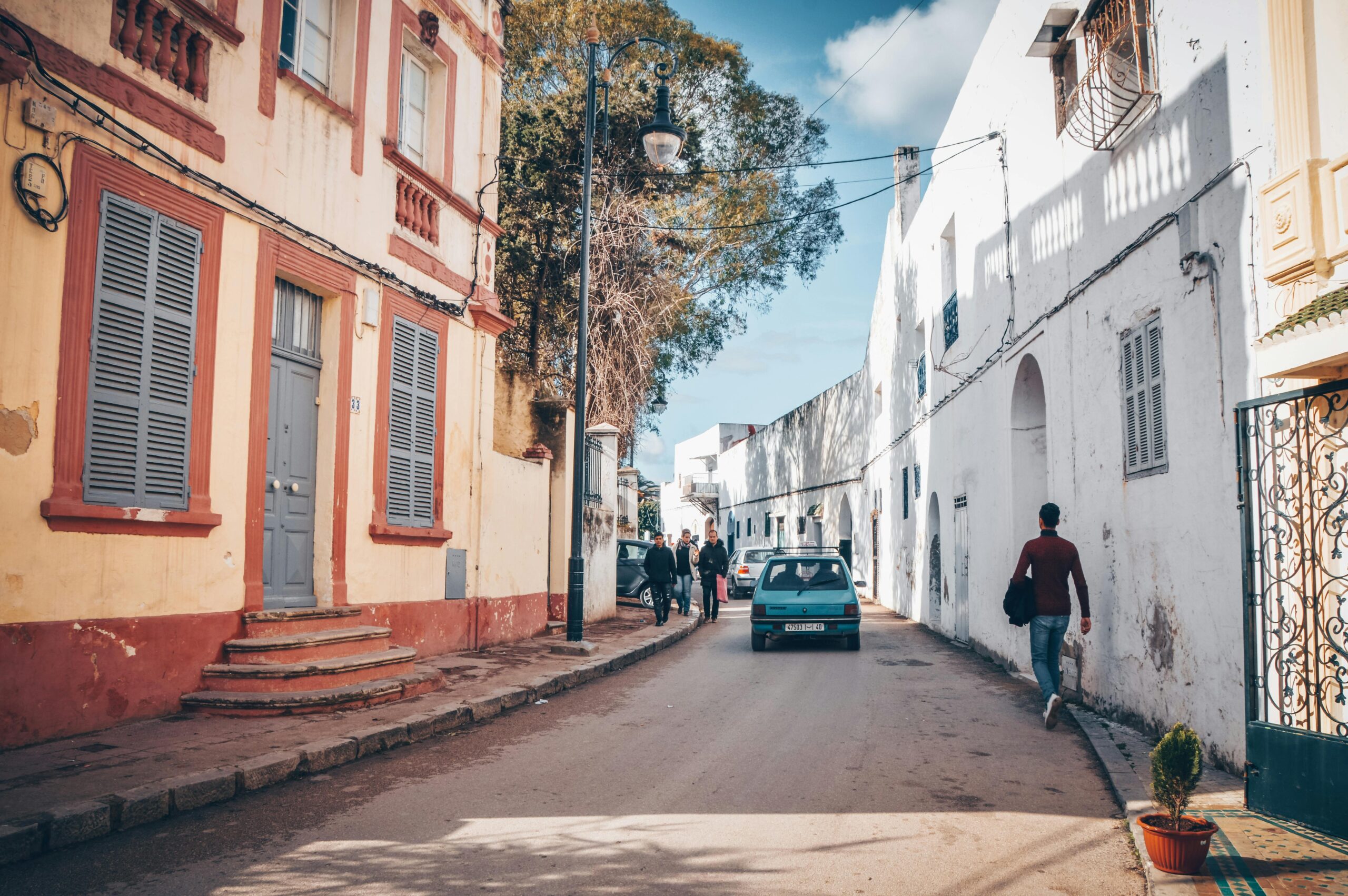 Charming street view of Tangier, Morocco with pedestrians and classic architecture.